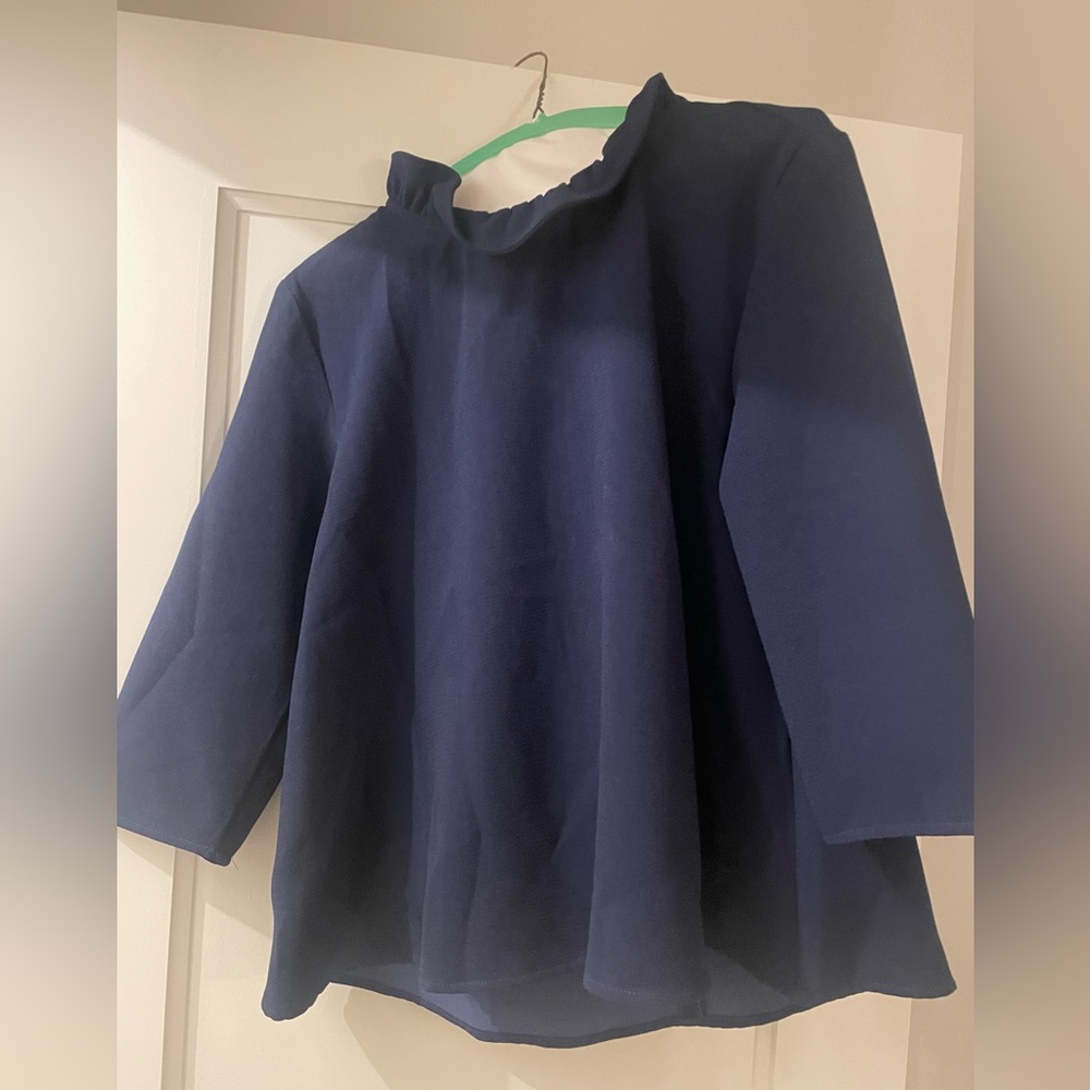 Navy pomander place ruffle neck top.  Medium.  Very good condition.